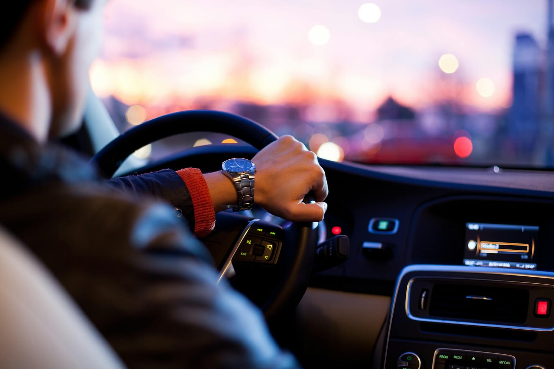 Man driving a car.